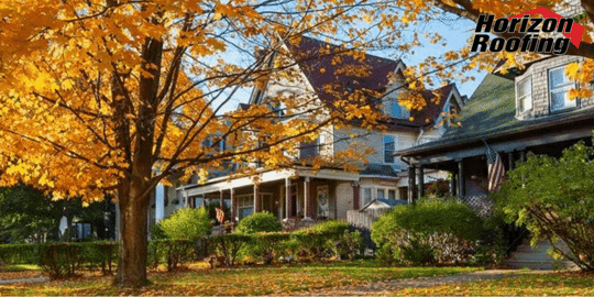 A tree and a house in fall season